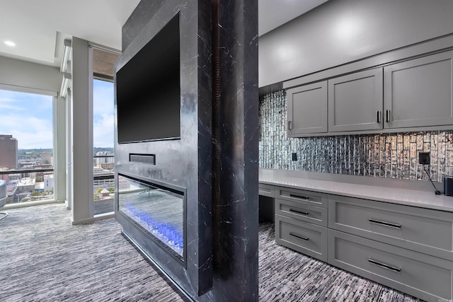 interior space featuring gray cabinets and decorative backsplash