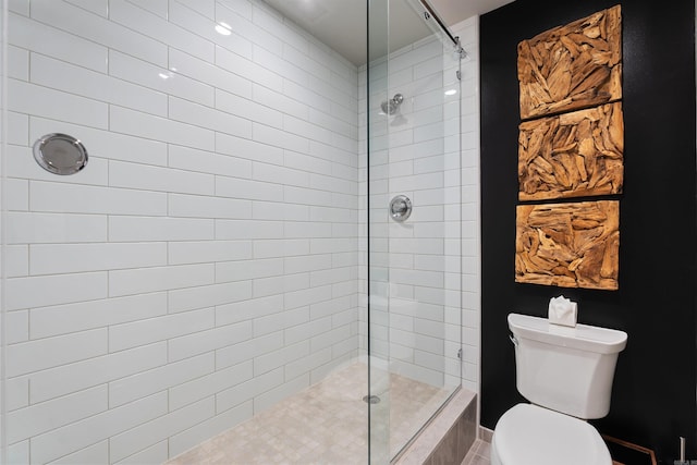 bathroom with toilet and tiled shower