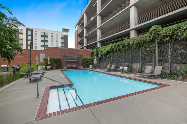 view of swimming pool with a patio area