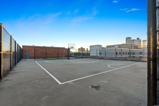 view of tennis court featuring basketball court