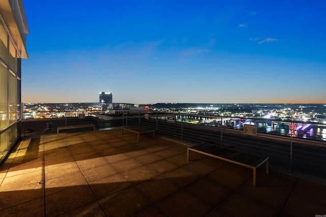 patio terrace at dusk with a balcony