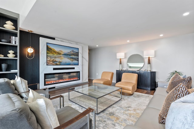 living room featuring hardwood / wood-style floors and a fireplace