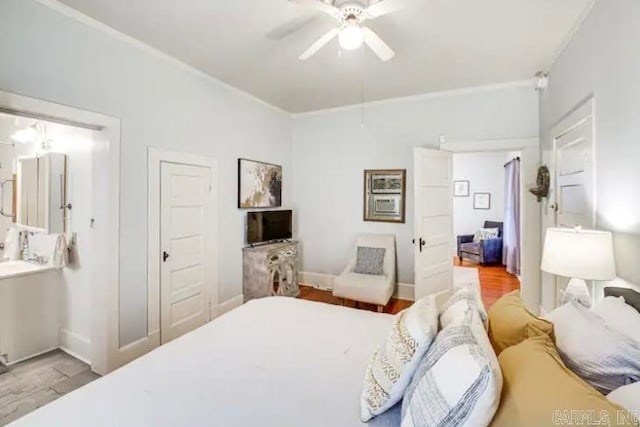 bedroom featuring a closet, ceiling fan, ornamental molding, and hardwood / wood-style floors