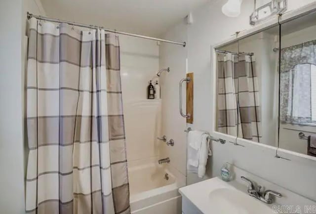 bathroom with shower / bath combo and vanity