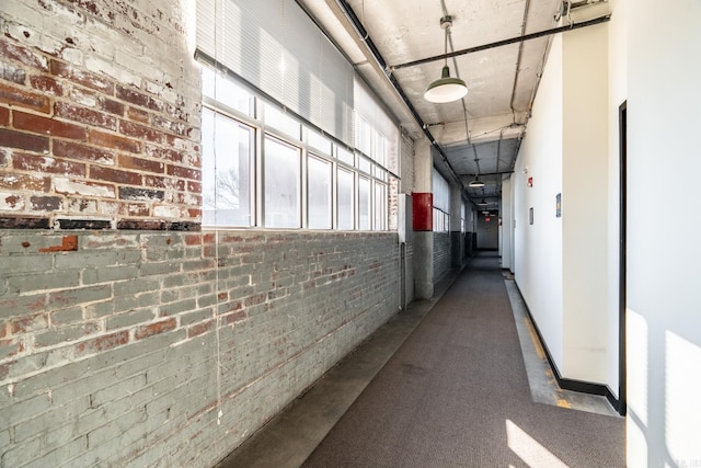 hallway with brick wall