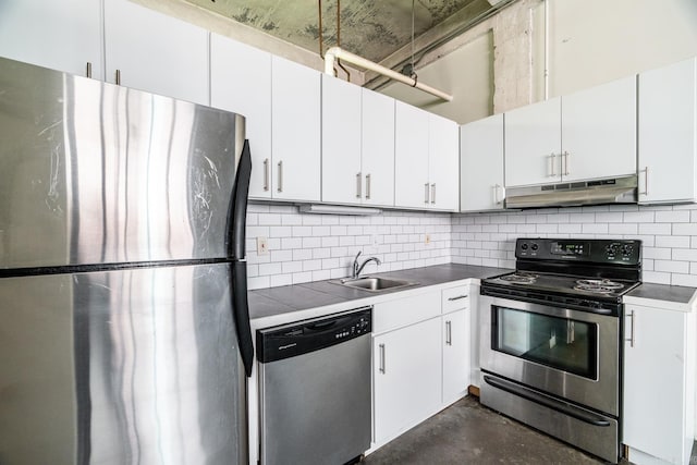 kitchen featuring appliances with stainless steel finishes, backsplash, sink, and white cabinets