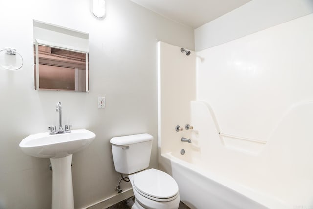 bathroom featuring toilet and shower / bathtub combination