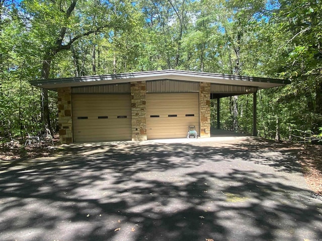 garage featuring a carport