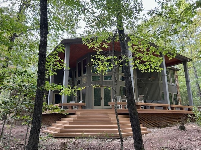 back of property with a wooden deck