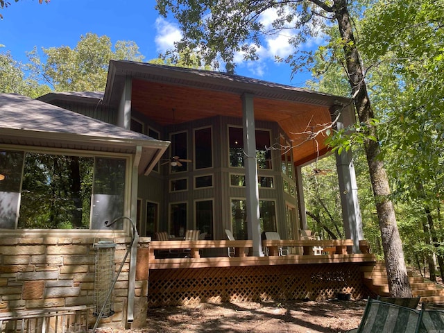 back of property with a wooden deck