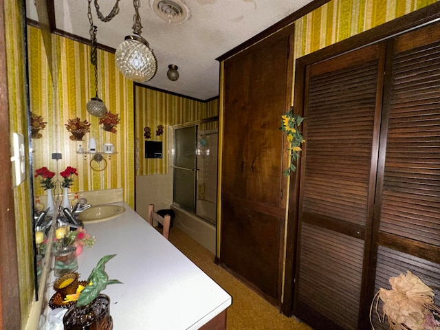 bathroom featuring vanity and enclosed tub / shower combo