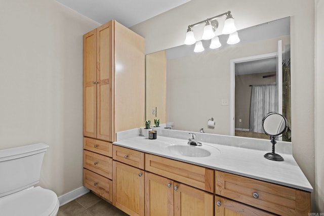 bathroom with tile patterned floors, toilet, and vanity