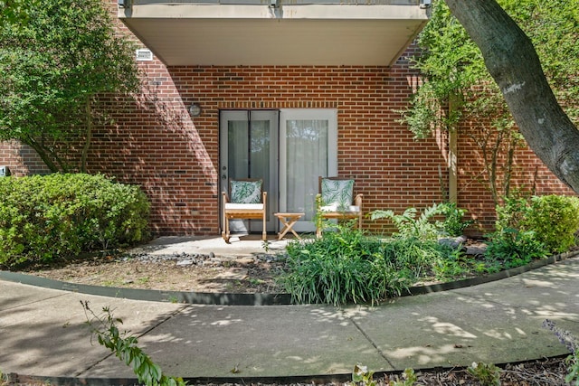 entrance to property with a patio