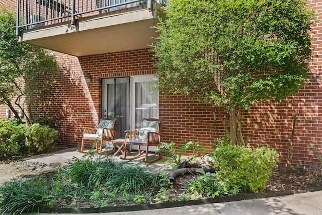 exterior space with a balcony and a patio