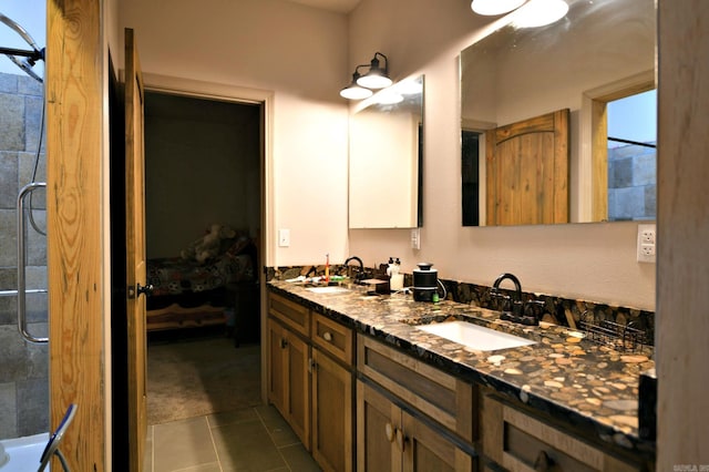 bathroom with vanity, tile patterned floors, and walk in shower