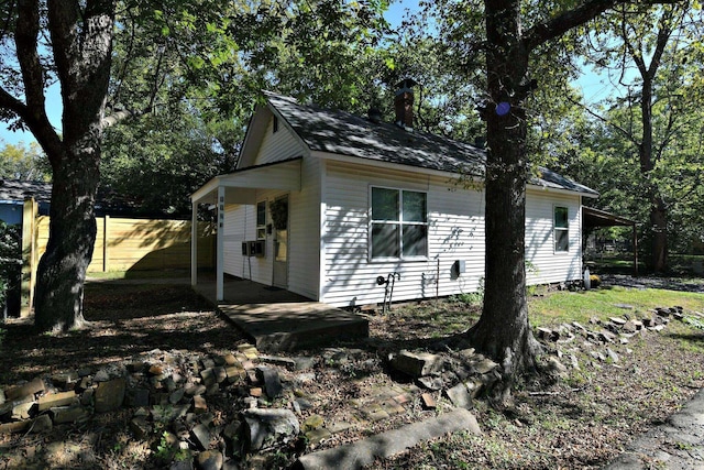 view of side of property with a patio