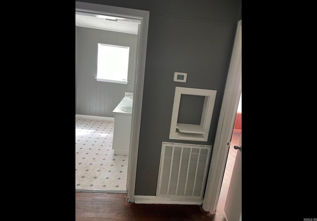 corridor featuring dark wood-type flooring