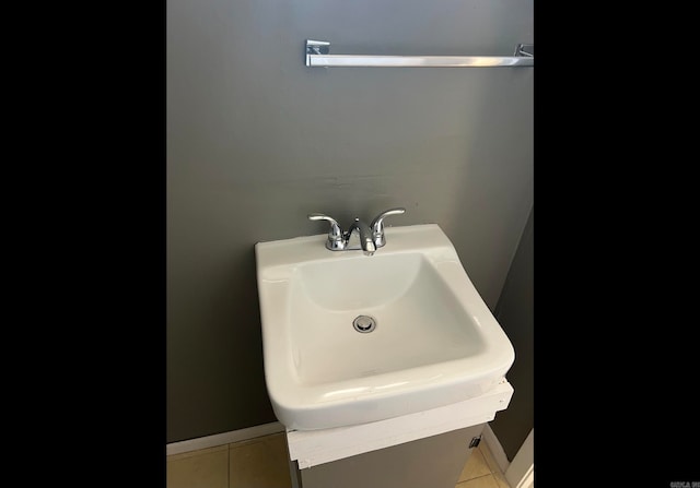 bathroom with tile patterned floors and sink