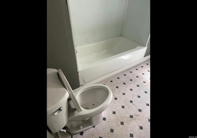 bathroom featuring toilet and a bathing tub