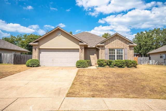 single story home featuring a garage, brick siding, driveway, and fence