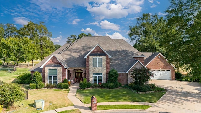 view of front of property with a garage and a front yard