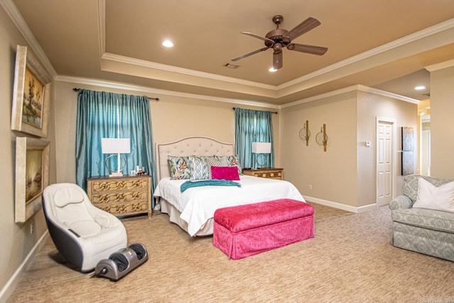 bedroom featuring crown molding, light colored carpet, a tray ceiling, and ceiling fan