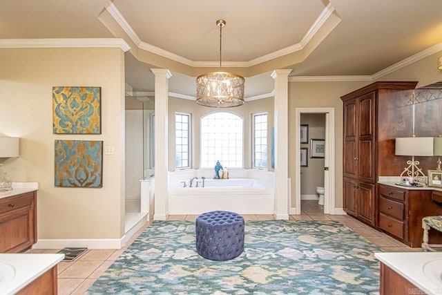 full bathroom with decorative columns, toilet, and vanity