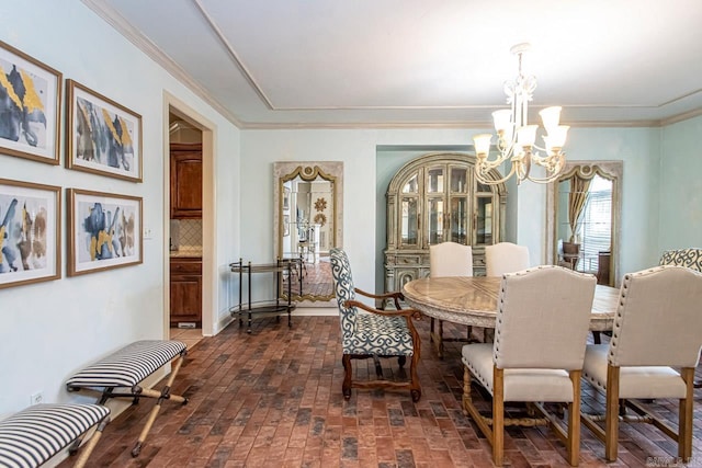 dining room featuring an inviting chandelier and ornamental molding