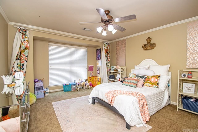 bedroom with ornamental molding, ceiling fan, and carpet