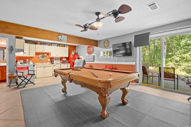 playroom with billiards, ceiling fan, light tile patterned floors, and a textured ceiling