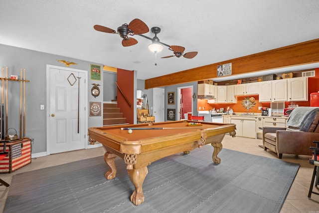 playroom with billiards, a textured ceiling, sink, ceiling fan, and light tile patterned flooring