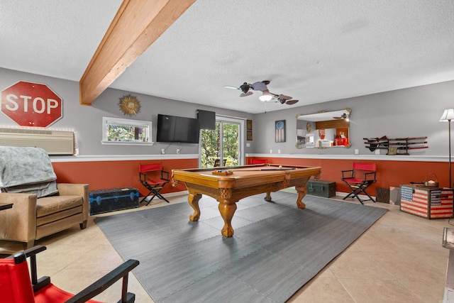 recreation room with a textured ceiling, beamed ceiling, billiards, tile patterned flooring, and ceiling fan