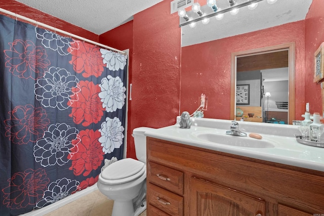 bathroom featuring a textured ceiling, vanity, toilet, a shower with curtain, and tile patterned floors