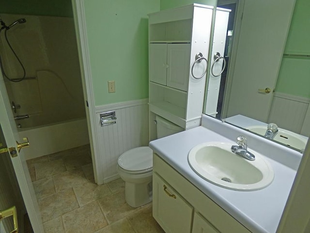 full bathroom featuring bathing tub / shower combination, vanity, and toilet