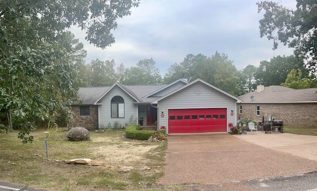 single story home with a front lawn and a garage