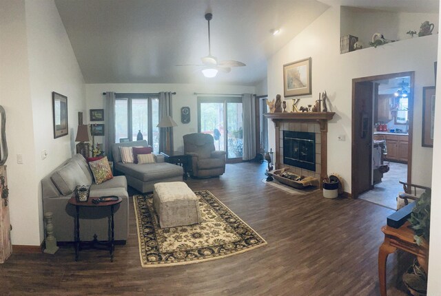 living room with ceiling fan, a fireplace, high vaulted ceiling, and dark hardwood / wood-style floors