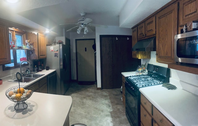 kitchen featuring black appliances, ceiling fan, and sink