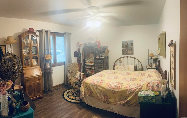 bedroom featuring ceiling fan and dark hardwood / wood-style flooring