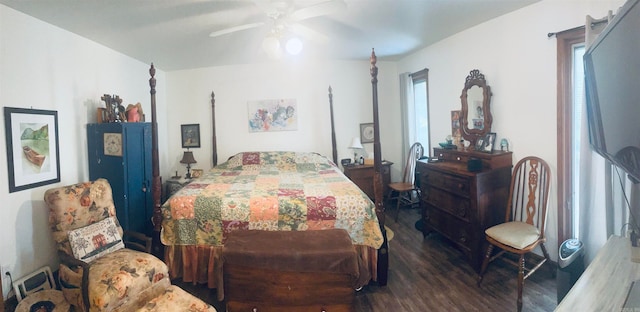 bedroom featuring ceiling fan and dark hardwood / wood-style flooring