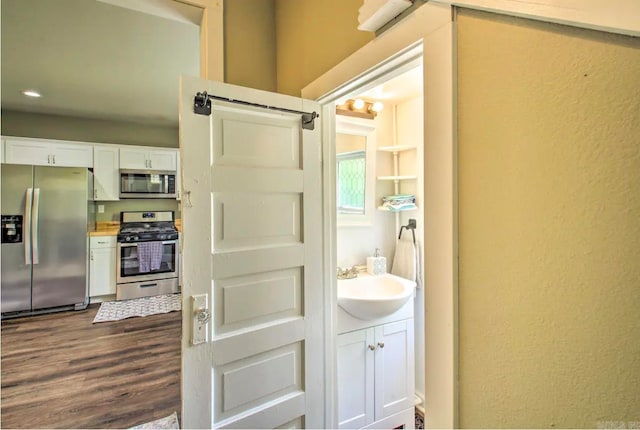 bathroom with vanity and hardwood / wood-style flooring