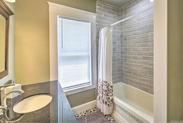 bathroom with vanity and shower / bathtub combination with curtain