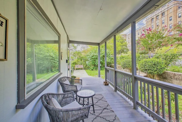 wooden terrace with a porch