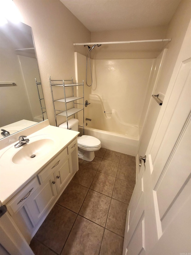 full bathroom with tile patterned floors, vanity, toilet, and shower / washtub combination