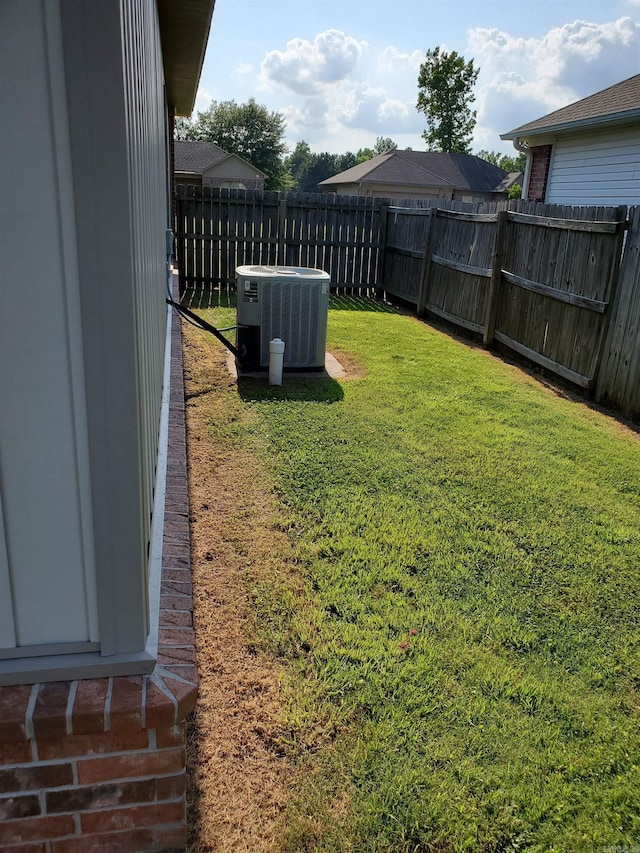 view of yard with central AC unit