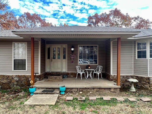 property entrance with covered porch