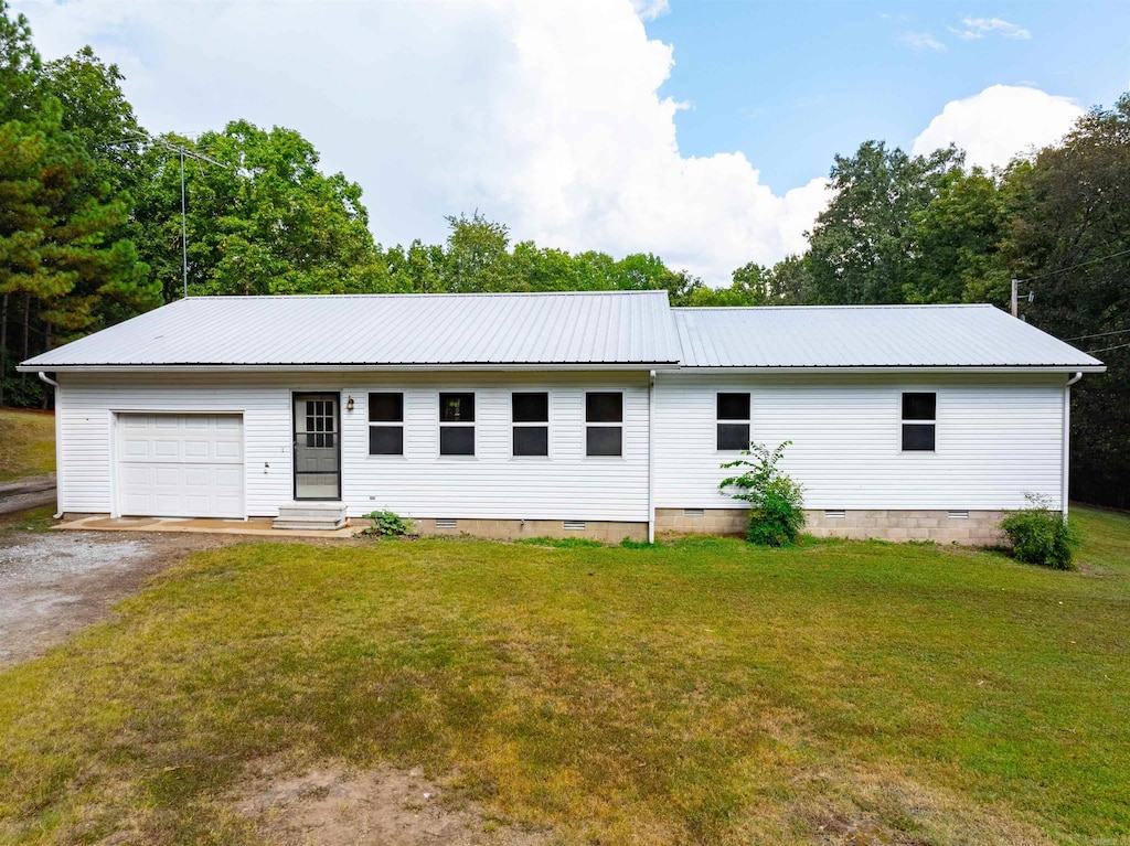 ranch-style home with a garage, metal roof, a front lawn, and crawl space