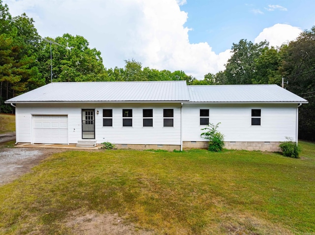 view of front facade with a garage and a front lawn