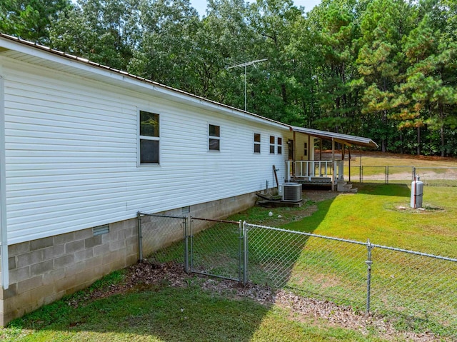 view of home's exterior with a lawn and a wooden deck