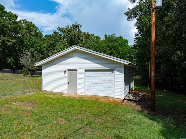 garage with a yard