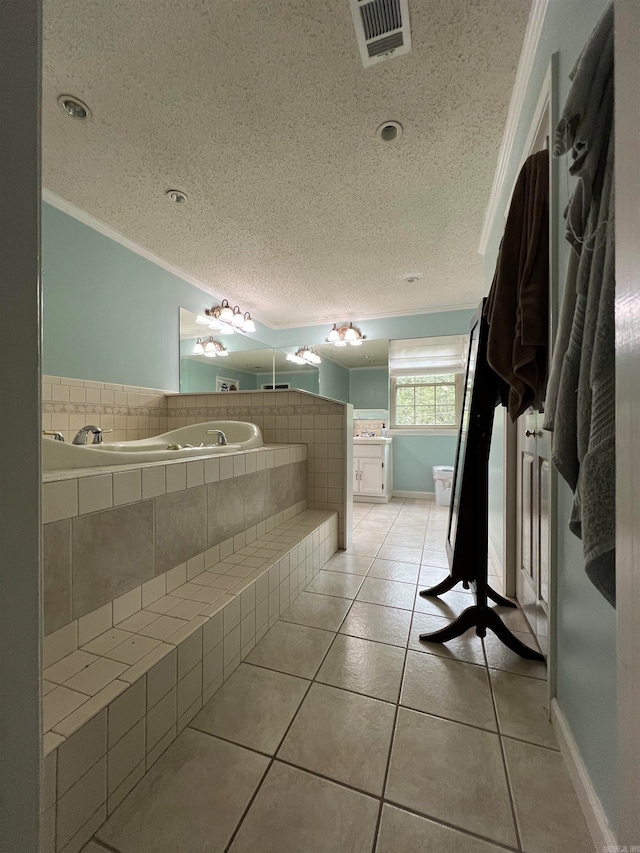 bathroom with tile patterned floors, a relaxing tiled tub, and ornamental molding